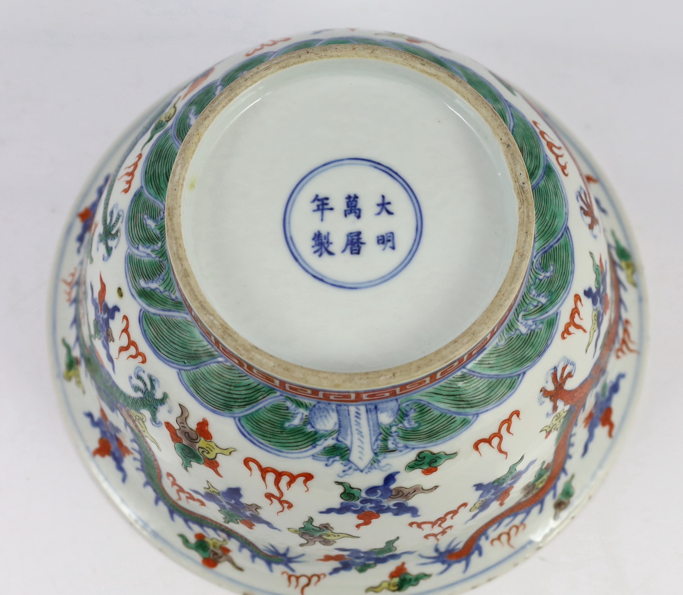 A Chinese doucai 'dragon' deep bowl, 19th century, small chip and glaze losses to rim